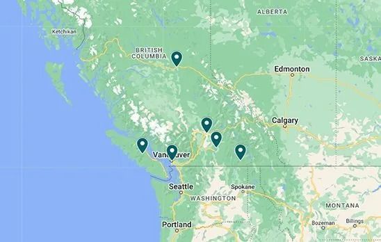 A map of British Columbia, Canada with a bunch of pins on it.