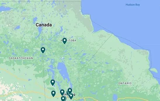 A map of Manitoba, Canada with a bunch of pins on it