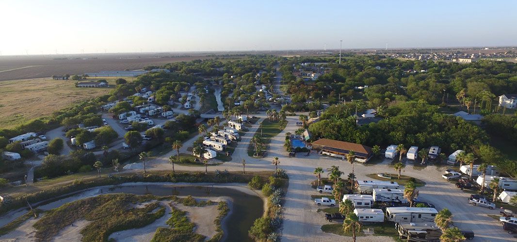 An aerial view of a campground filled with lots of rvs.