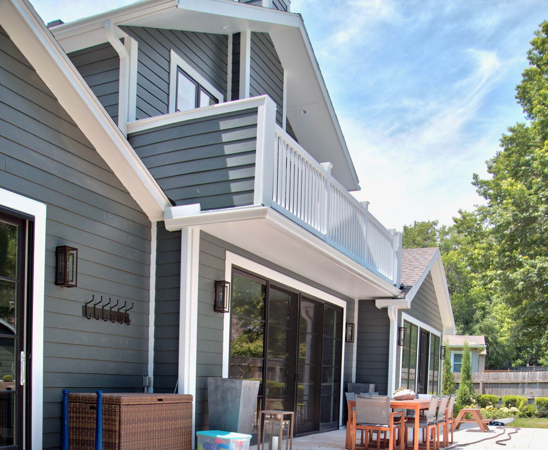 A large house with a balcony and a patio area