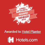 Red award badge reading “Loved by Guests Award Winner 2019” for Hotel Planter, Hotels.com logo below