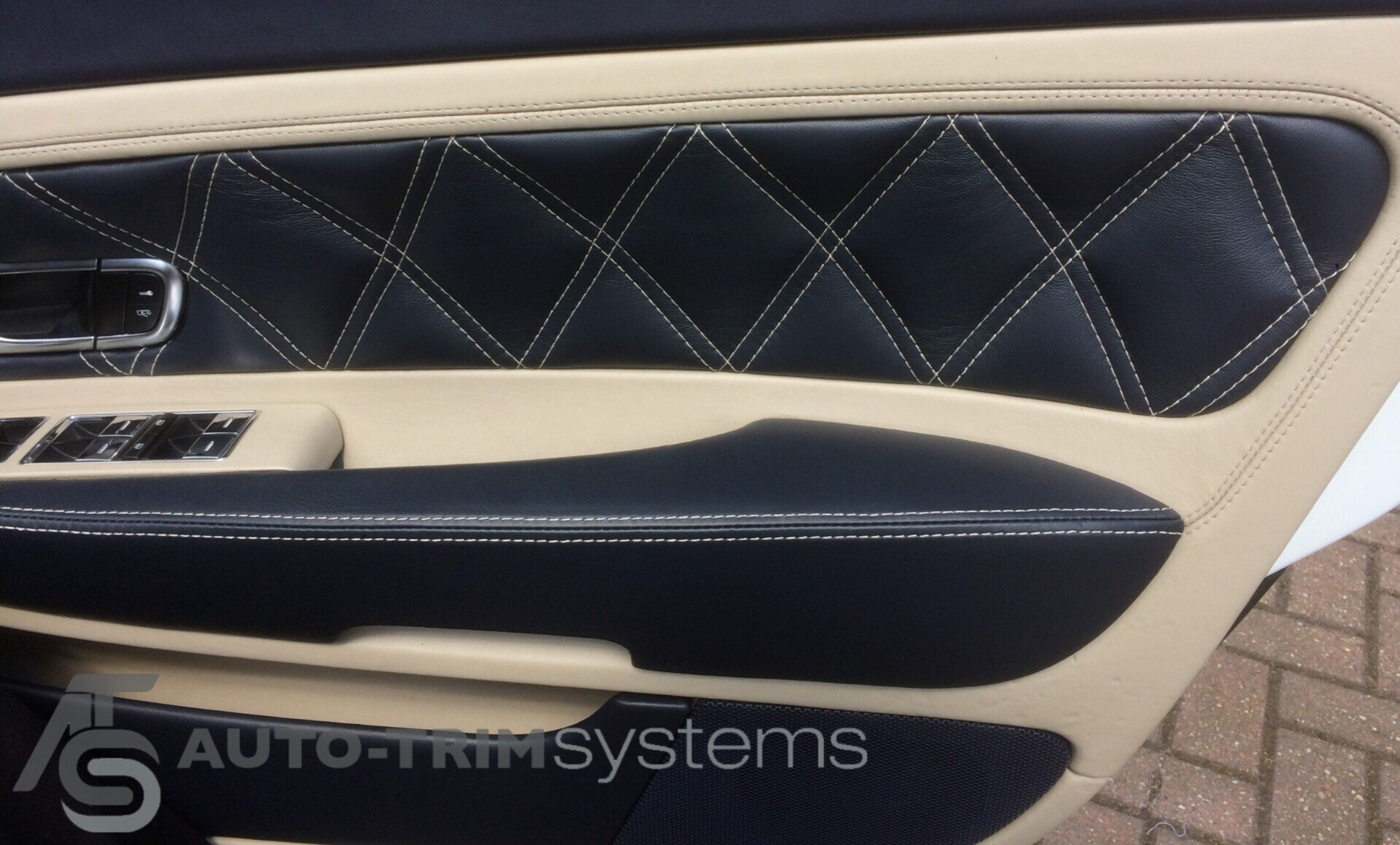 Bespoke black leather and beige diamond stitch design on a Bentley