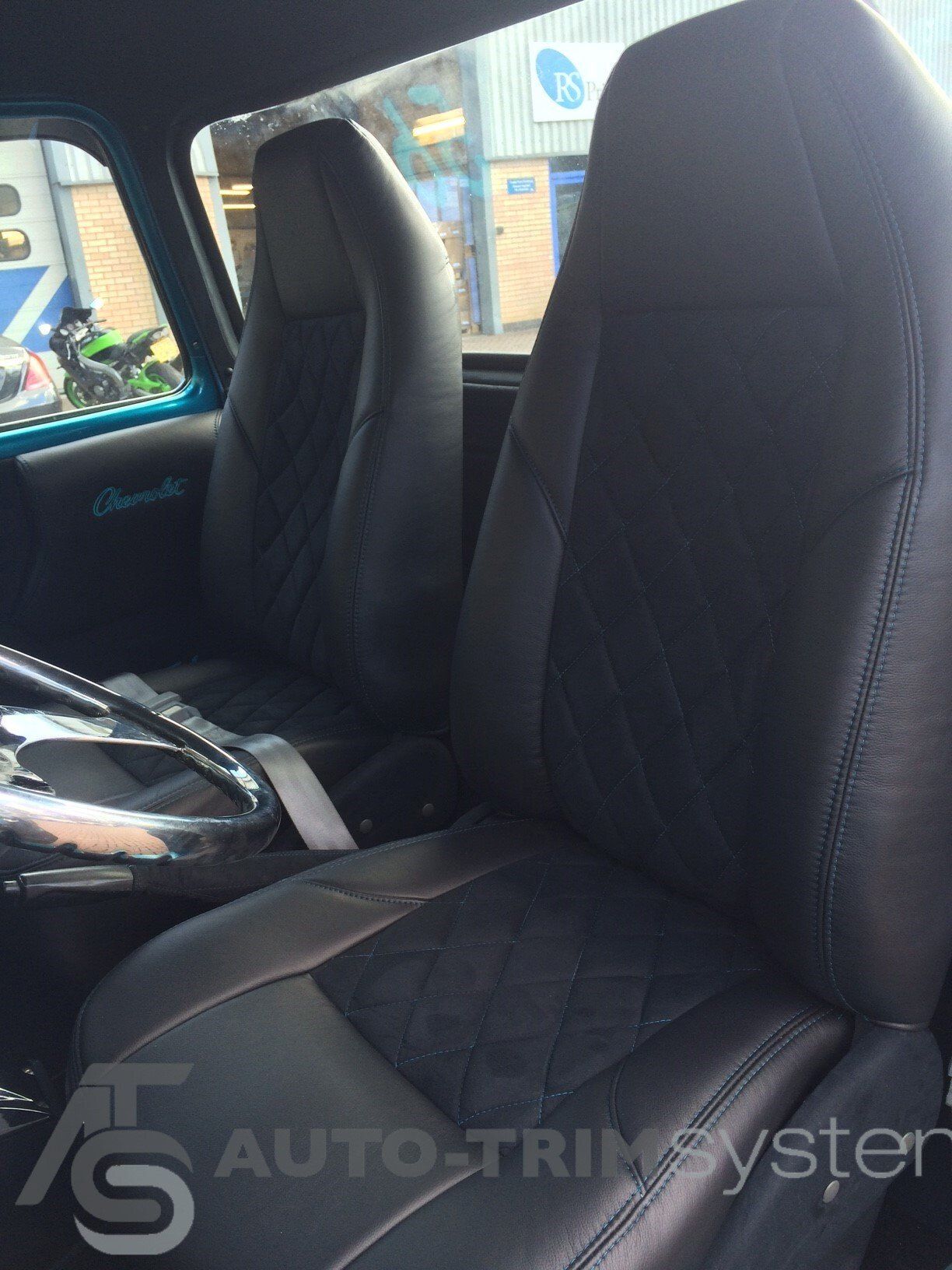 Modified '56 Chevrolet Pick-Up with custom diamond-stitch upholstery