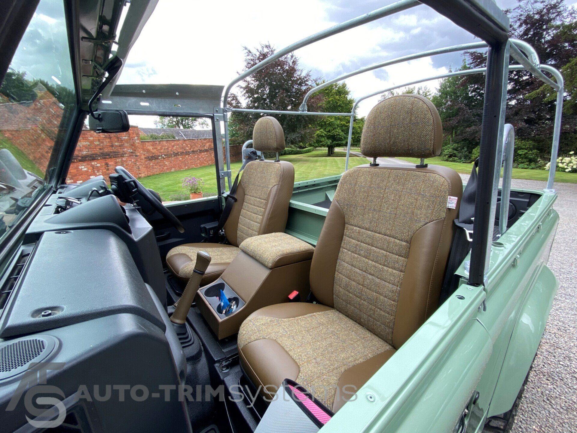 Light green Landrover Defender with customised tweed seats