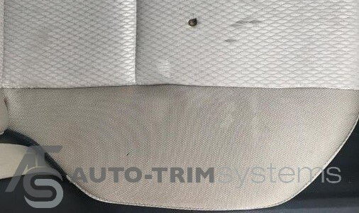 Cigarette burn in driver's seat base cushion
