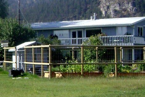 A house with a wooden fence in front of it