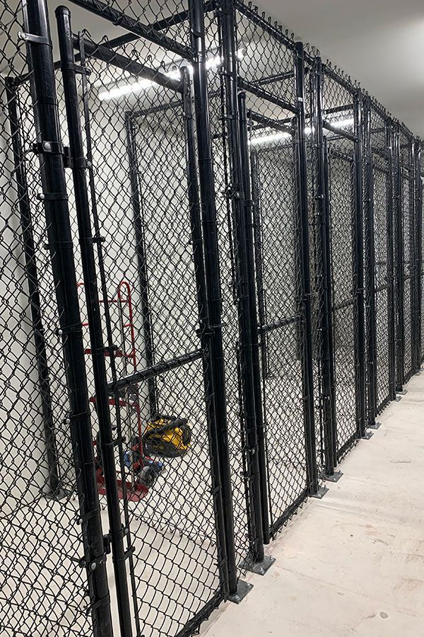 A row of chain link fences in a room.