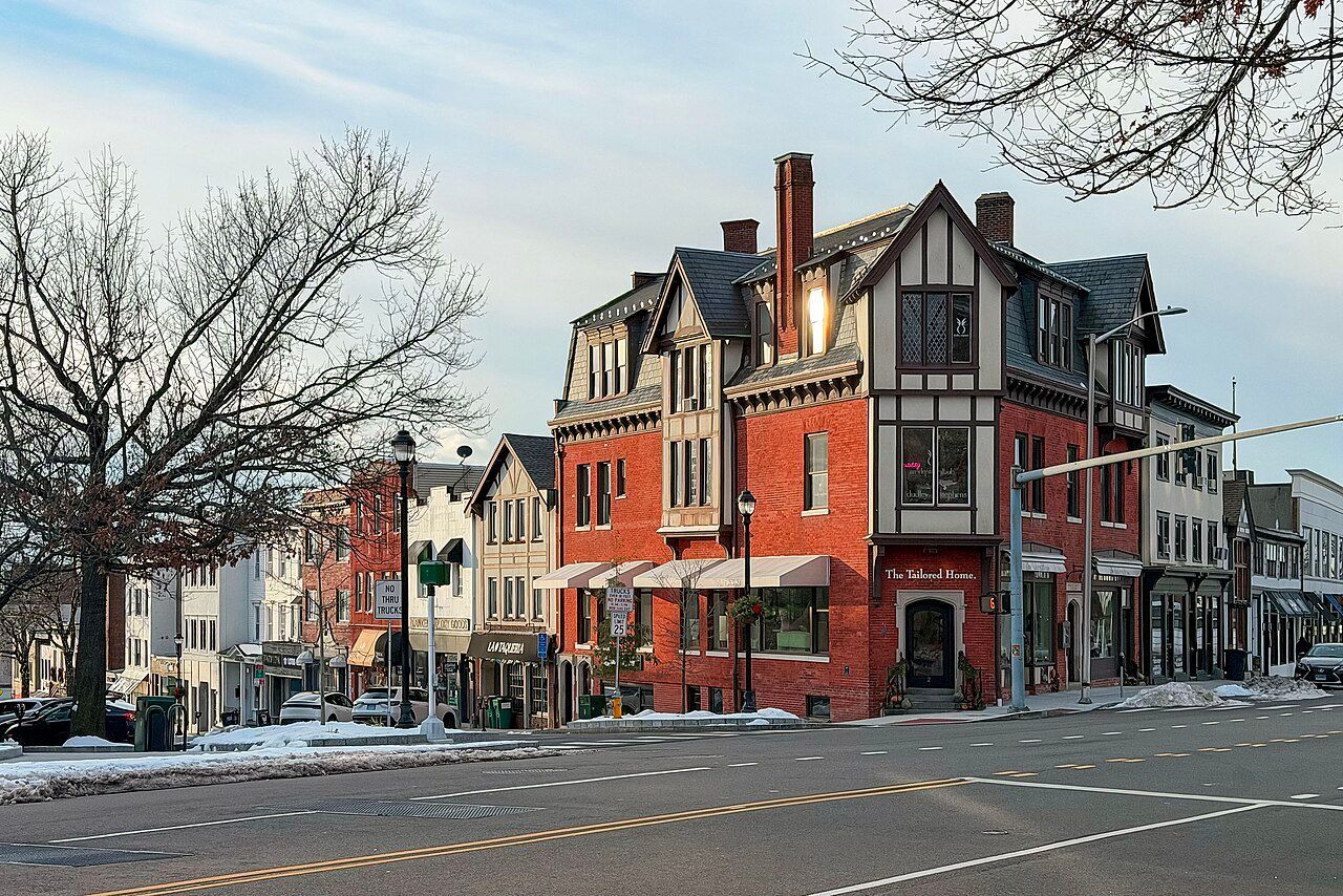 Multiple colors of buildings lining Greenwich Avenue in the Greenwich, CT historic district.