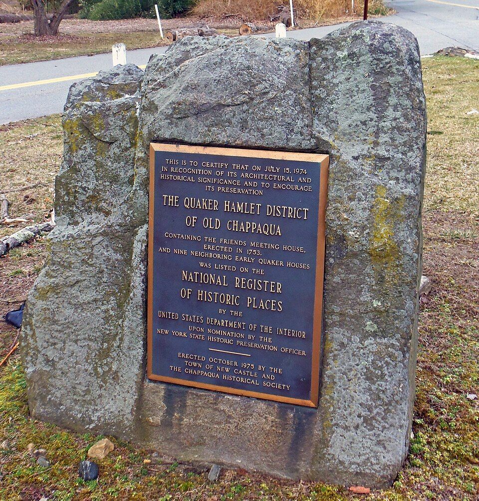 The Old Chappaque Historic District marker. It is a blue and bronze marker, embedded in a stone.