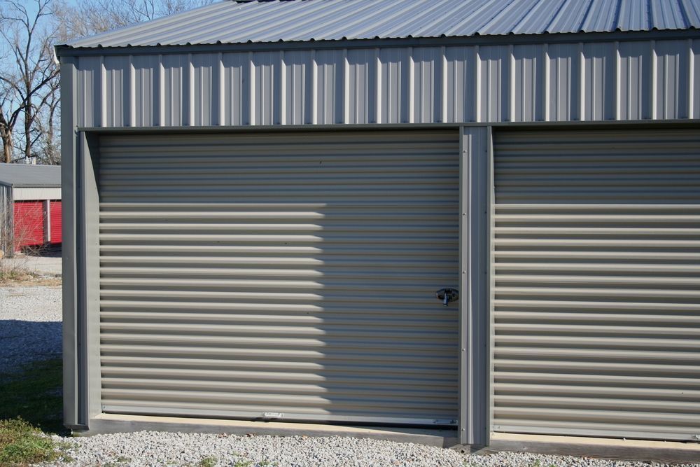 Gray Metal Roll-up Garage Doors — Tableland Self Storage In Atherton, QLD