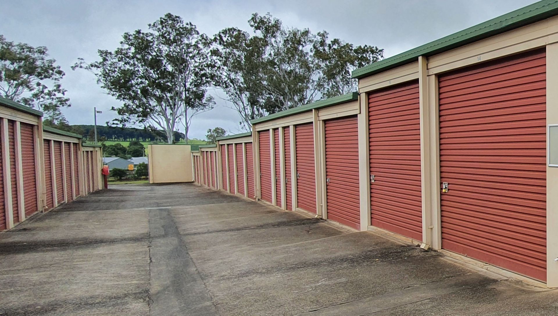 Red Industrial Roller Door — Tableland Self Storage In Atherton, QLD
