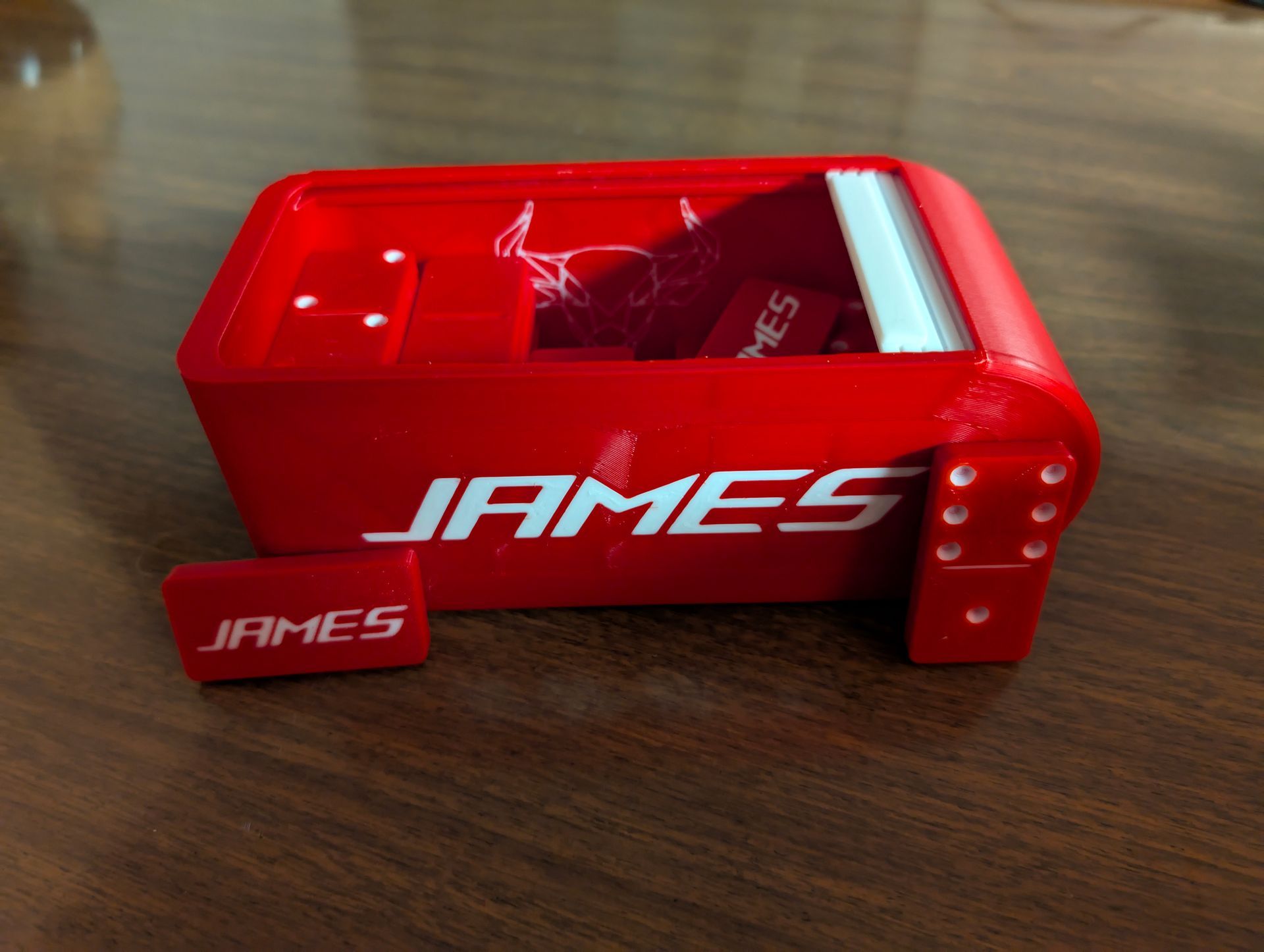 Red 3D-printed business card holder with the name 