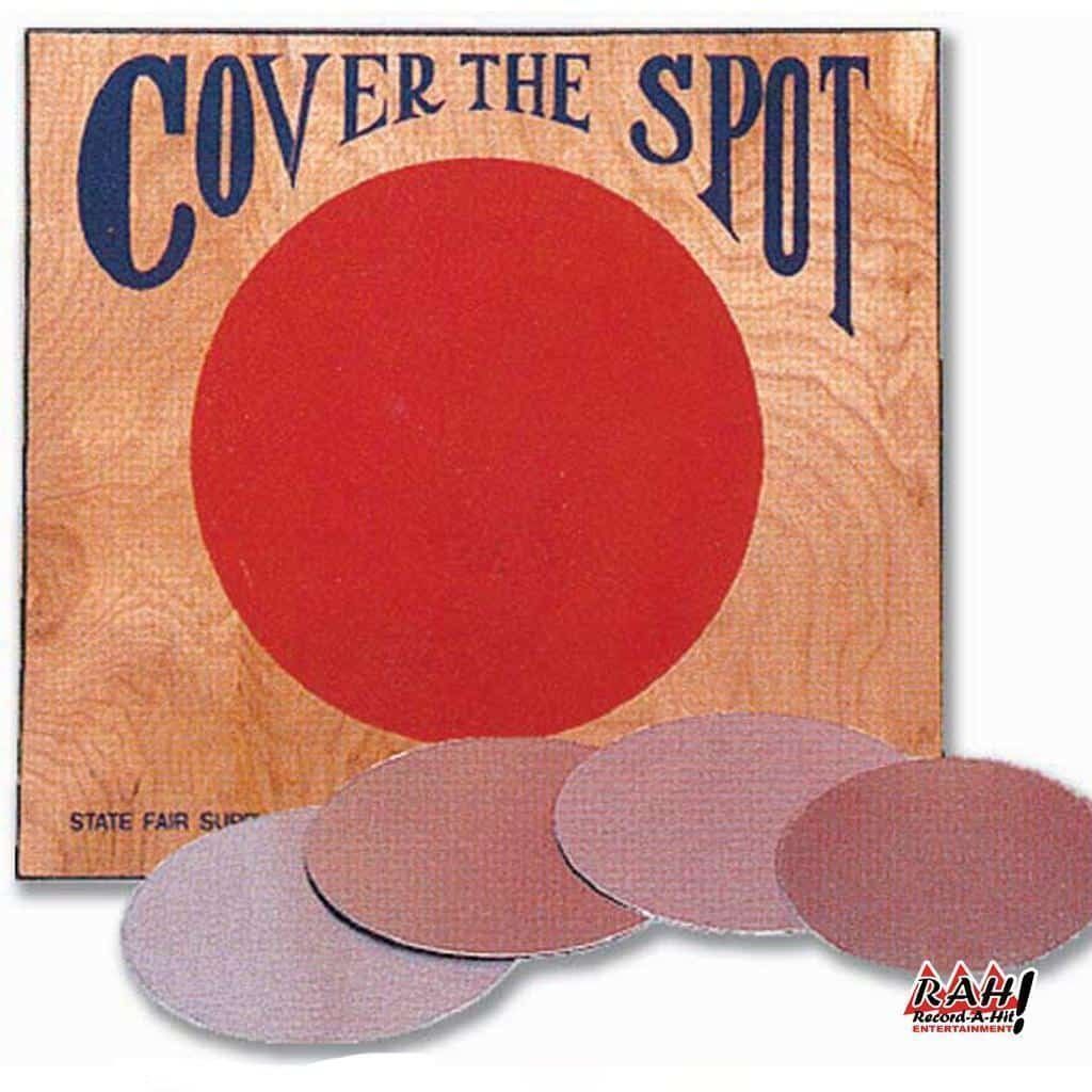A wooden sign that says cover the spot on it