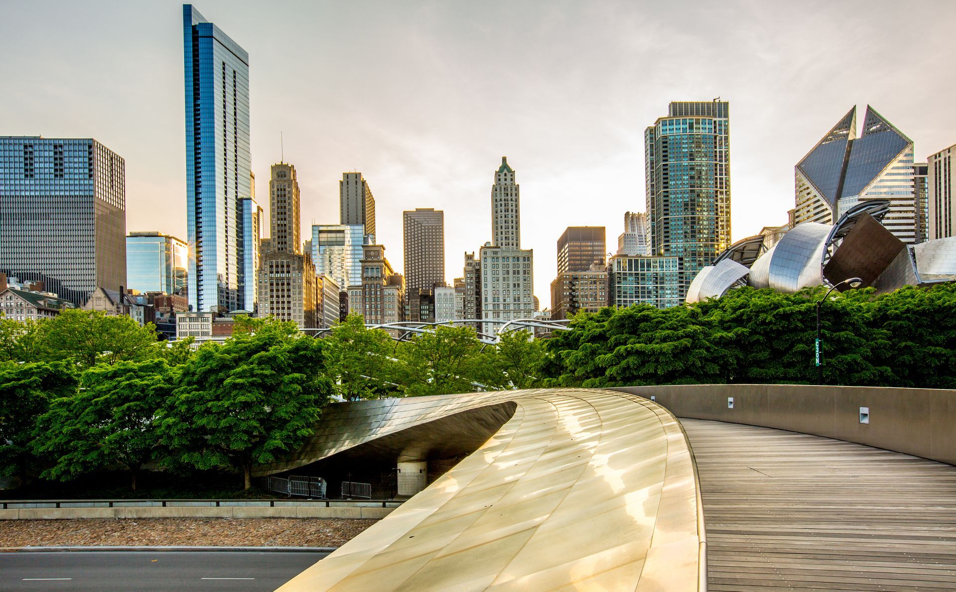 there is a bridge in the foreground and a city skyline in the background .