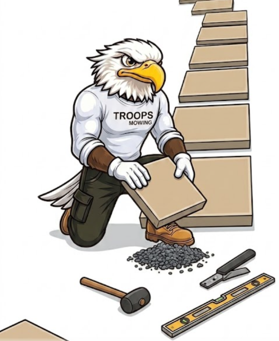 Mascot installing pavers