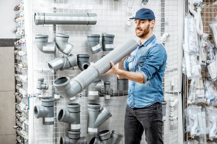 Man choosing pipes in the plumbing shop - Tacoma, WA - Rosen Plumbing Supply