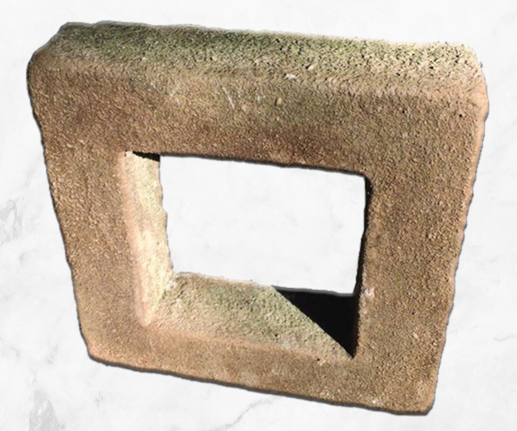 Square beige stone block with a rectangular cutout opening