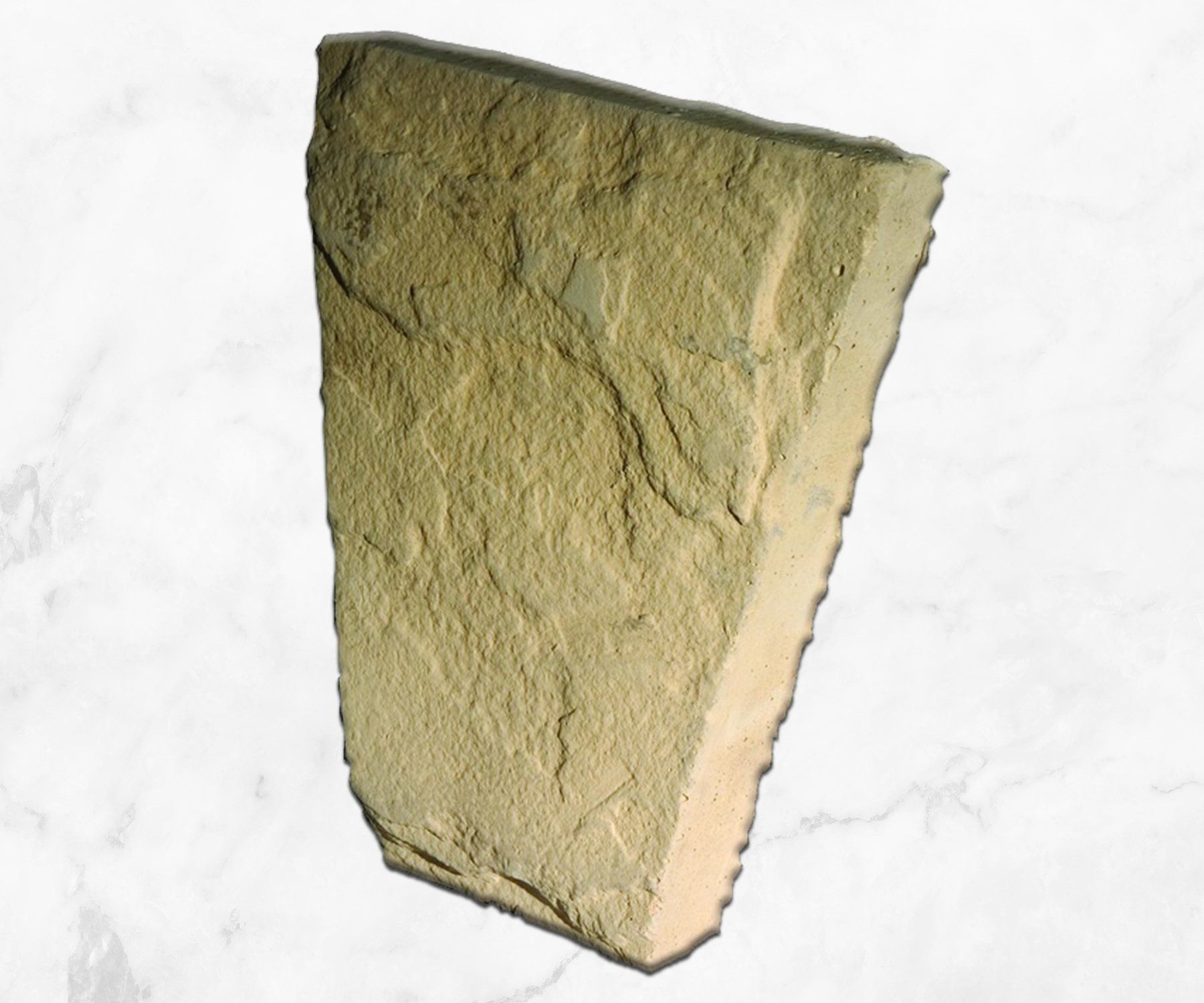 Greenish-tan rock or mineral sample with rough texture on a white background