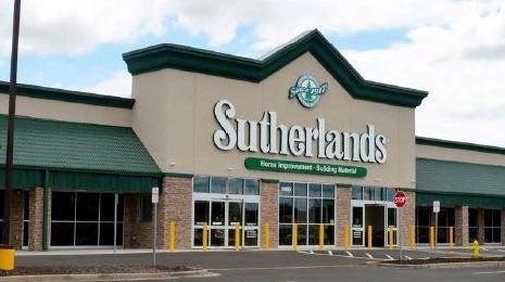 Sutherlands storefront with green roof and large sign above the entrance