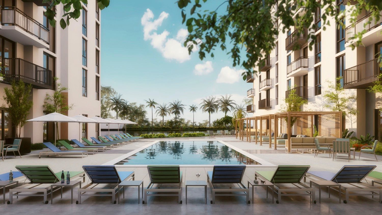 Modern apartment courtyard with a central pool, lounge chairs, and palm trees under a bright sky