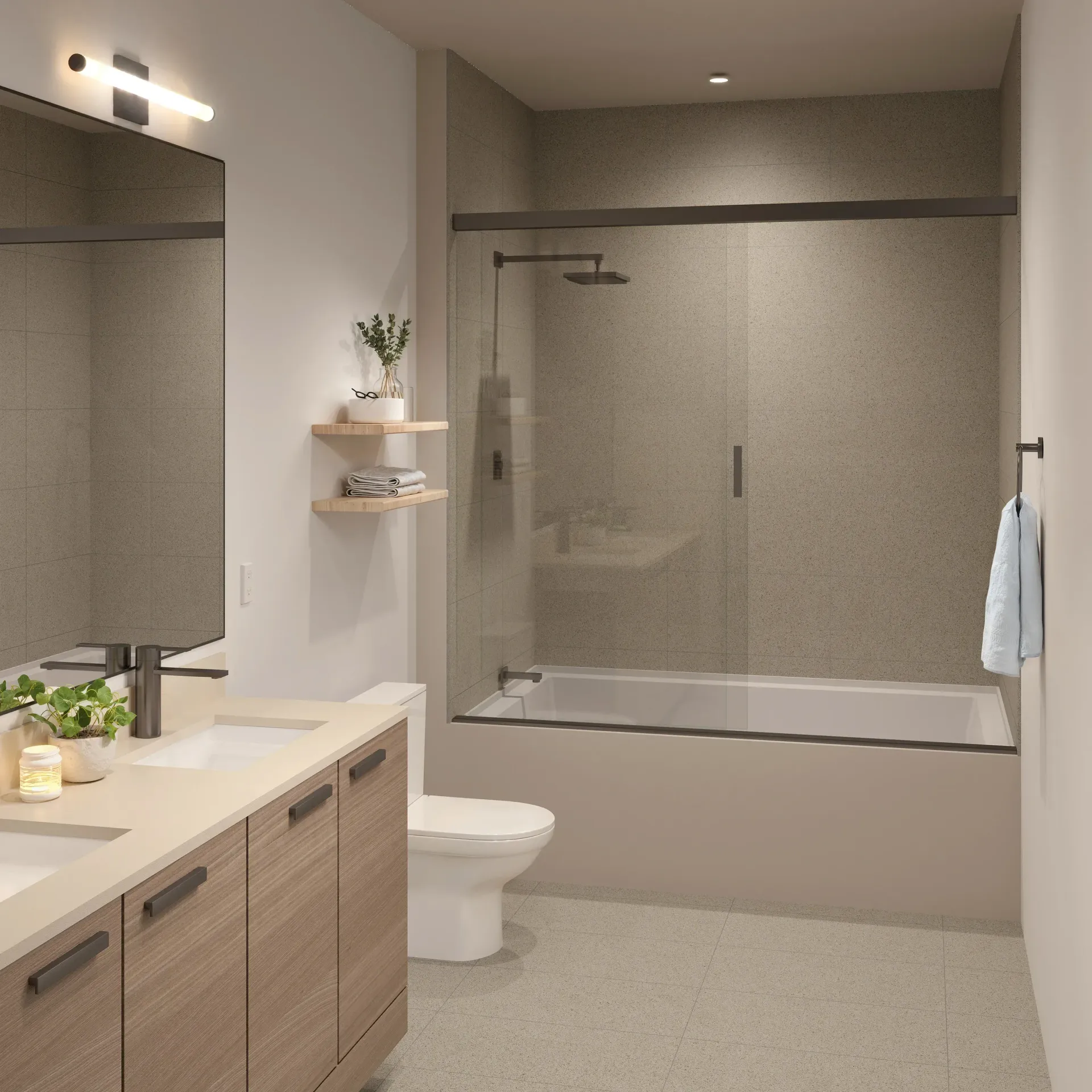 Modern bathroom with vanity, toilet, and glass-enclosed shower in neutral beige tones