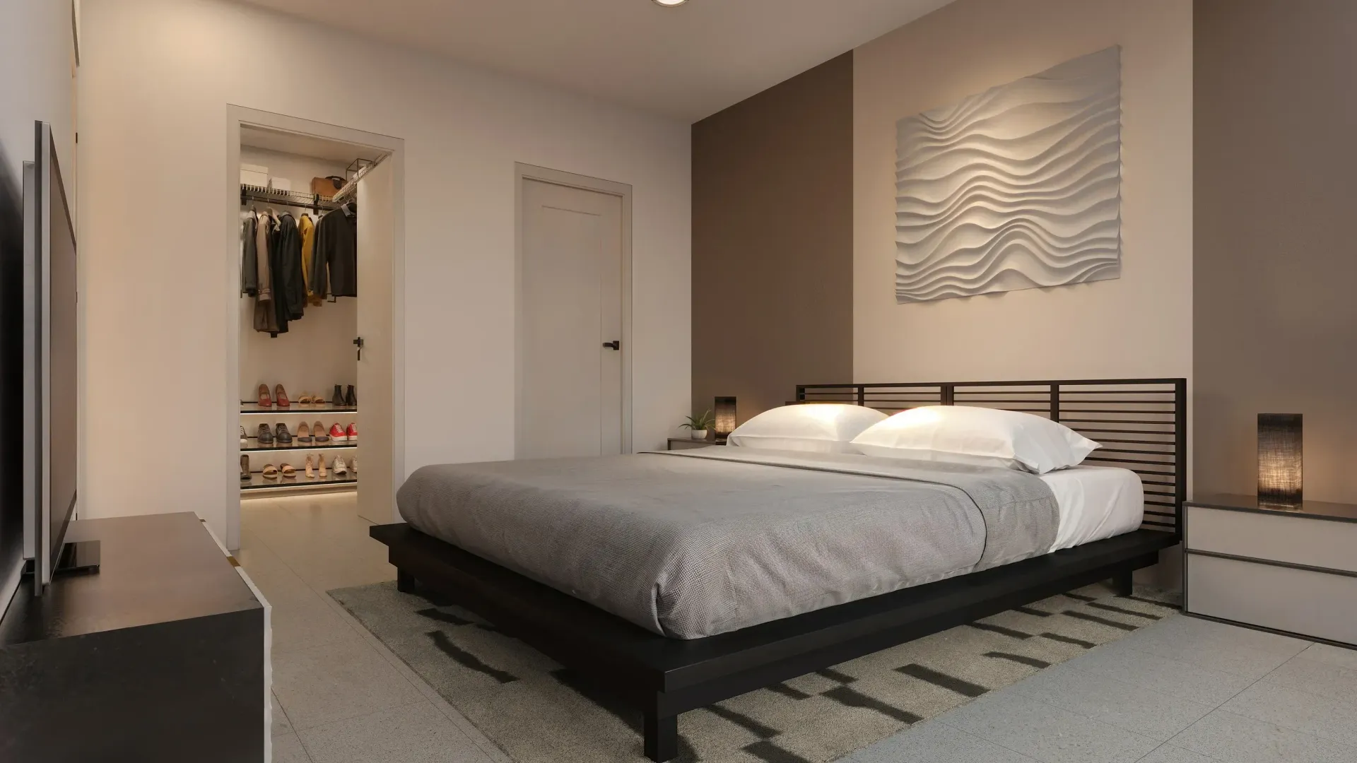 Modern bedroom with a low black bed, neutral decor, open closet, and woven wall art