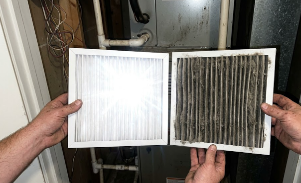 Side-by-side comparison of a clean white HVAC air filter and a dirty filter.