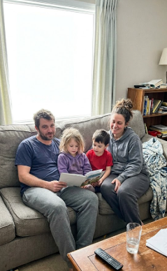A happy family enjoying a perfectly heated and cooled living room.