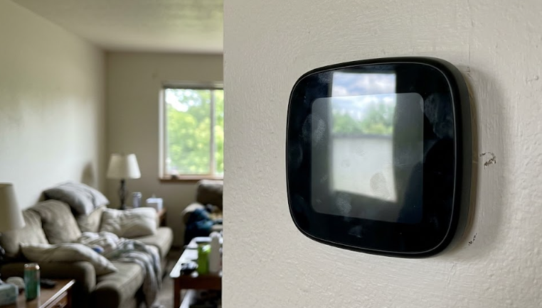 A modern digital thermostat set to a comfortable temperature for winter heating.