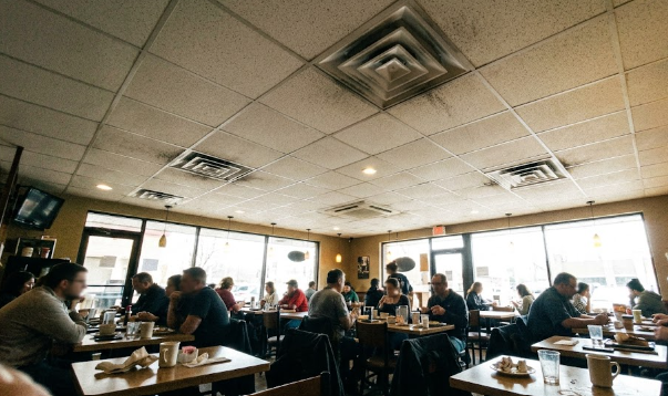 Happy customers enjoying a comfortable indoor climate inside a local Spokane business.