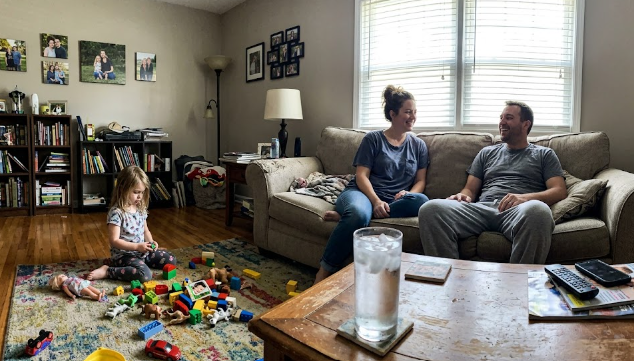 A happy family staying cool in their home after a fast air conditioning repair.