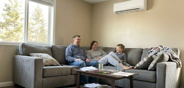 A family enjoying the cool comfort of their Spokane home after a new air conditioner installation.