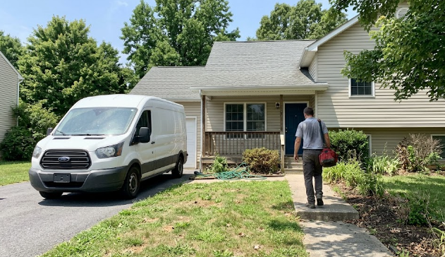 Spokane Heating and Cooling service van arriving at a home for an AC repair appointment.
