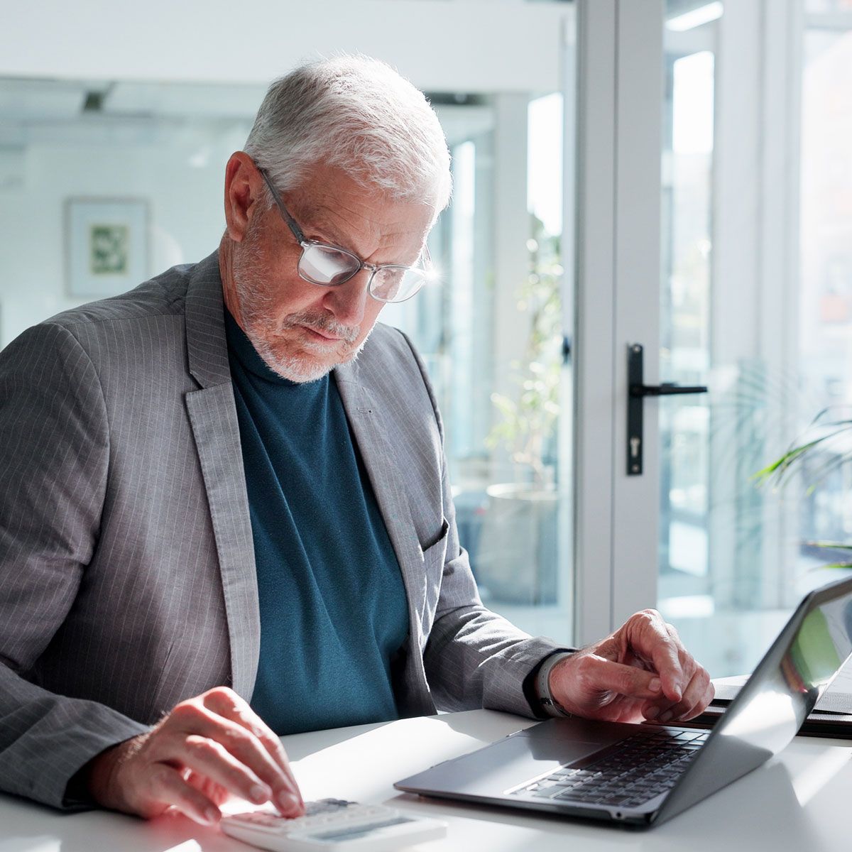 Payroll professional in Draper, Utah, helping process payroll for a business.