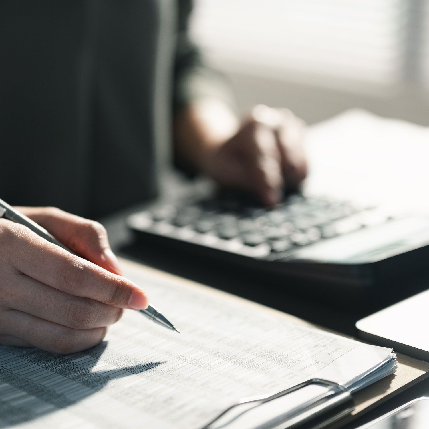 Payroll professional in Draper, Utah, helping process payroll for a business.