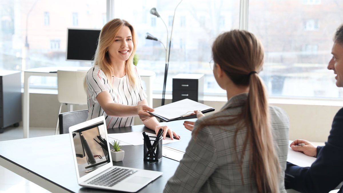 HR professional meeting with employees to discuss workplace policies and support