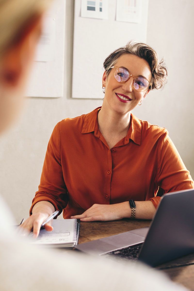 Recruiting specialist meeting with a client about hiring support and candidate selection