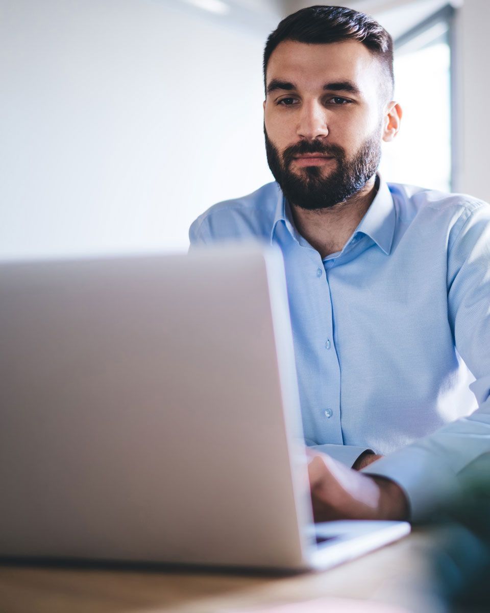 Business professional reviewing AI-powered workforce and payroll insights