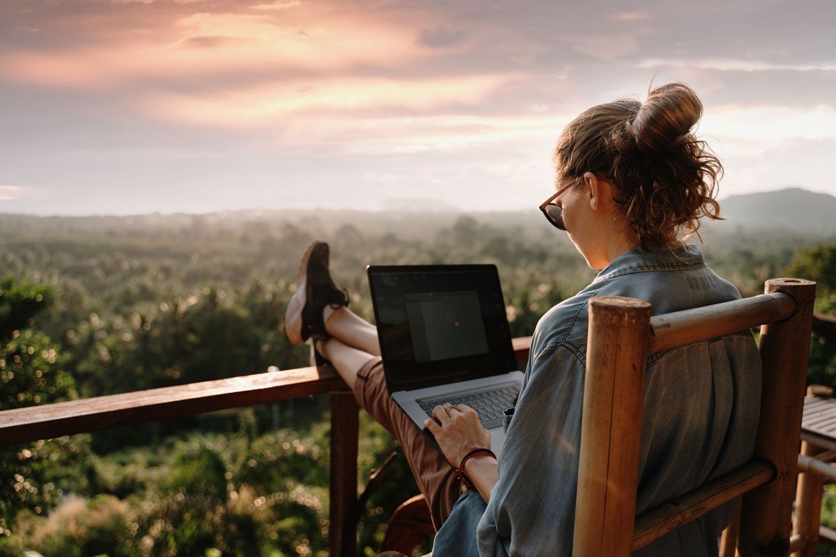 Remote employee using a laptop to manage PTO tracking and time-off requests