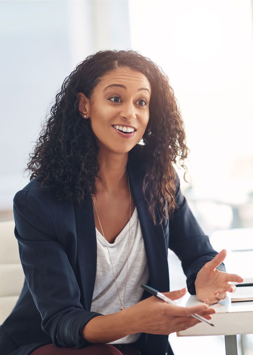 Business professional discussing workers’ compensation support and risk management services