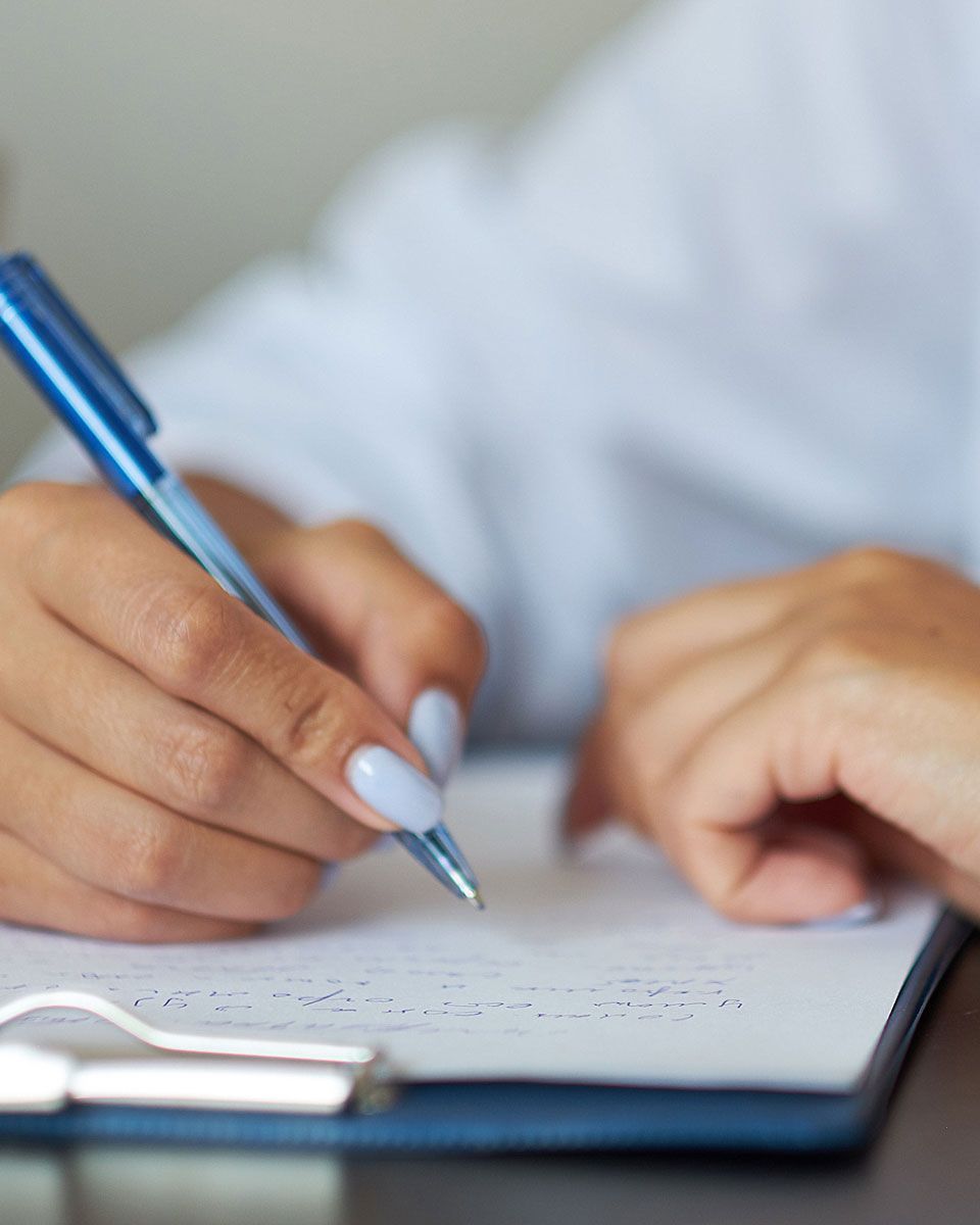 Professional completing workers’ compensation paperwork for injury reporting and claims management