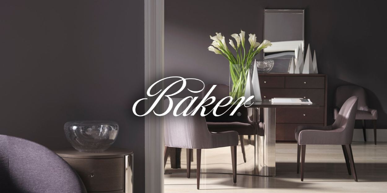Baker furniture showroom: dining room with table, chairs, flowers, and dresser in shades of gray.
