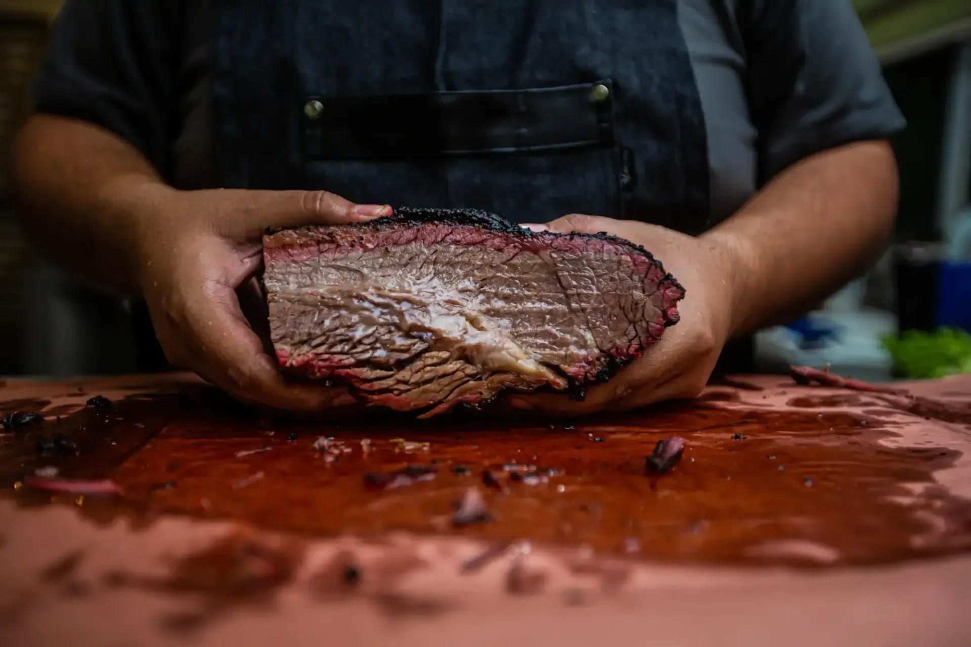 Large rack of smoked ribs standing upright displaying clean exposed bones from an authentic low and