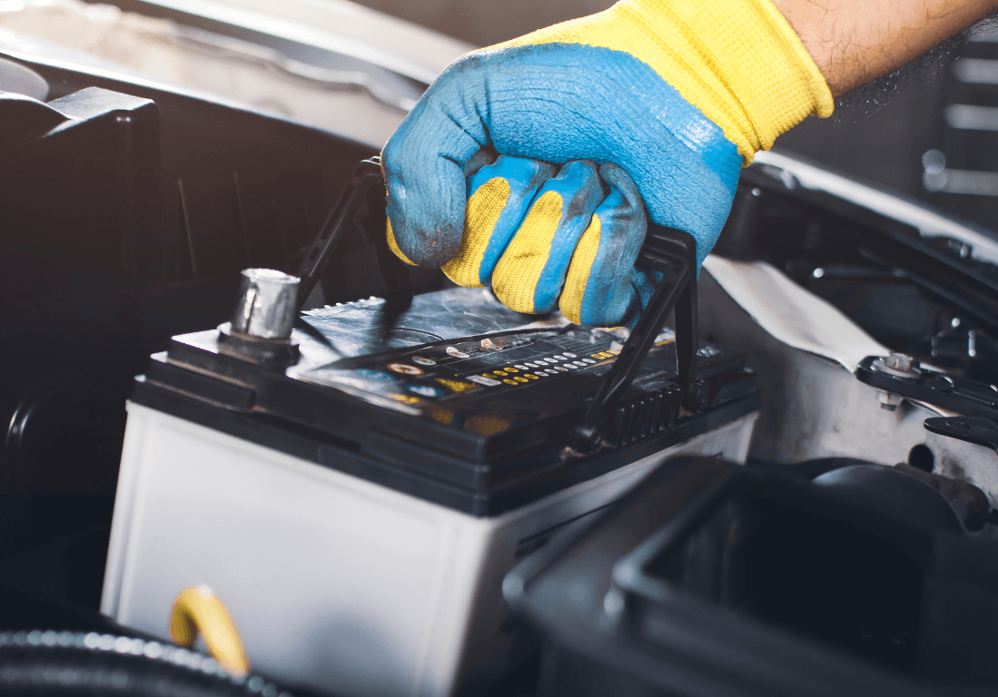 a mechanic changing a car battery