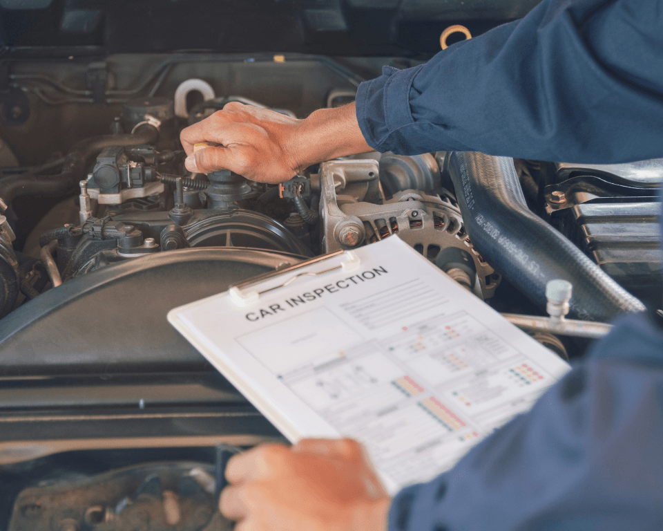 a mechanic performing a car inspection