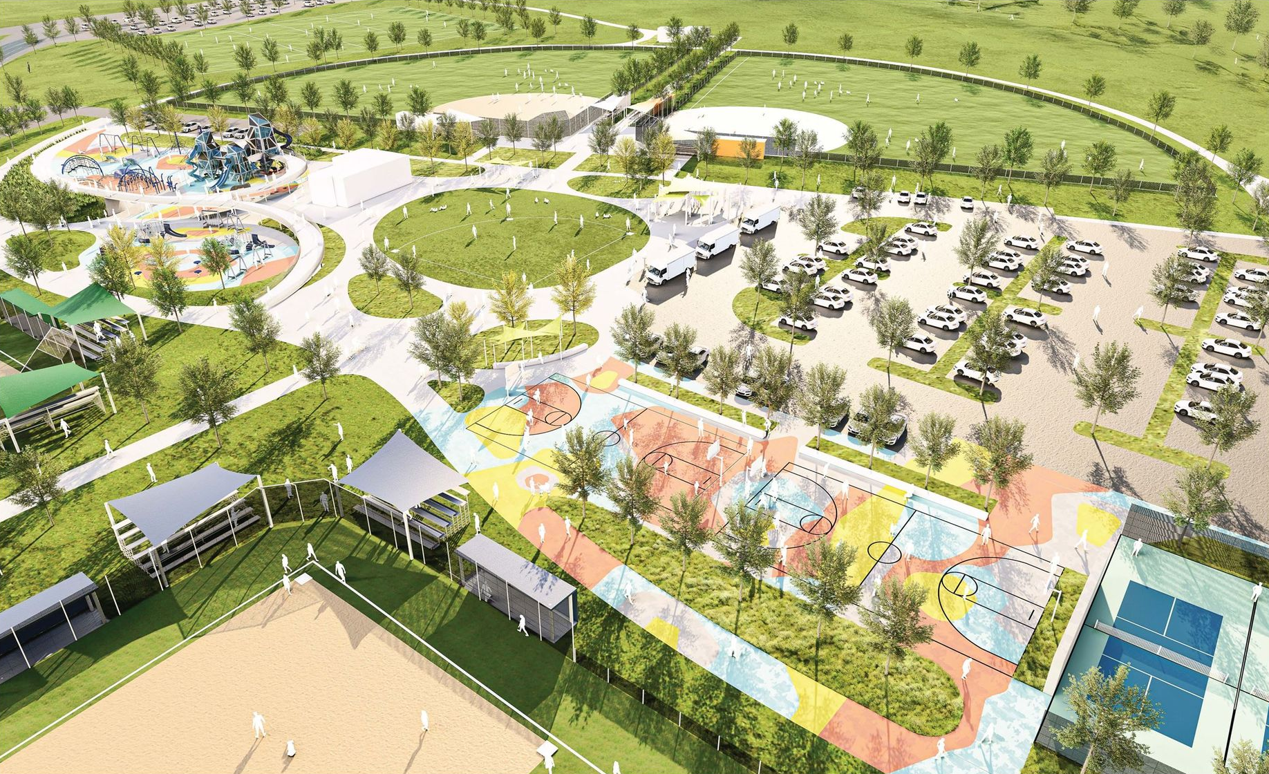 Aerial view of a park with sports fields, playgrounds, parking, and a large central green space.