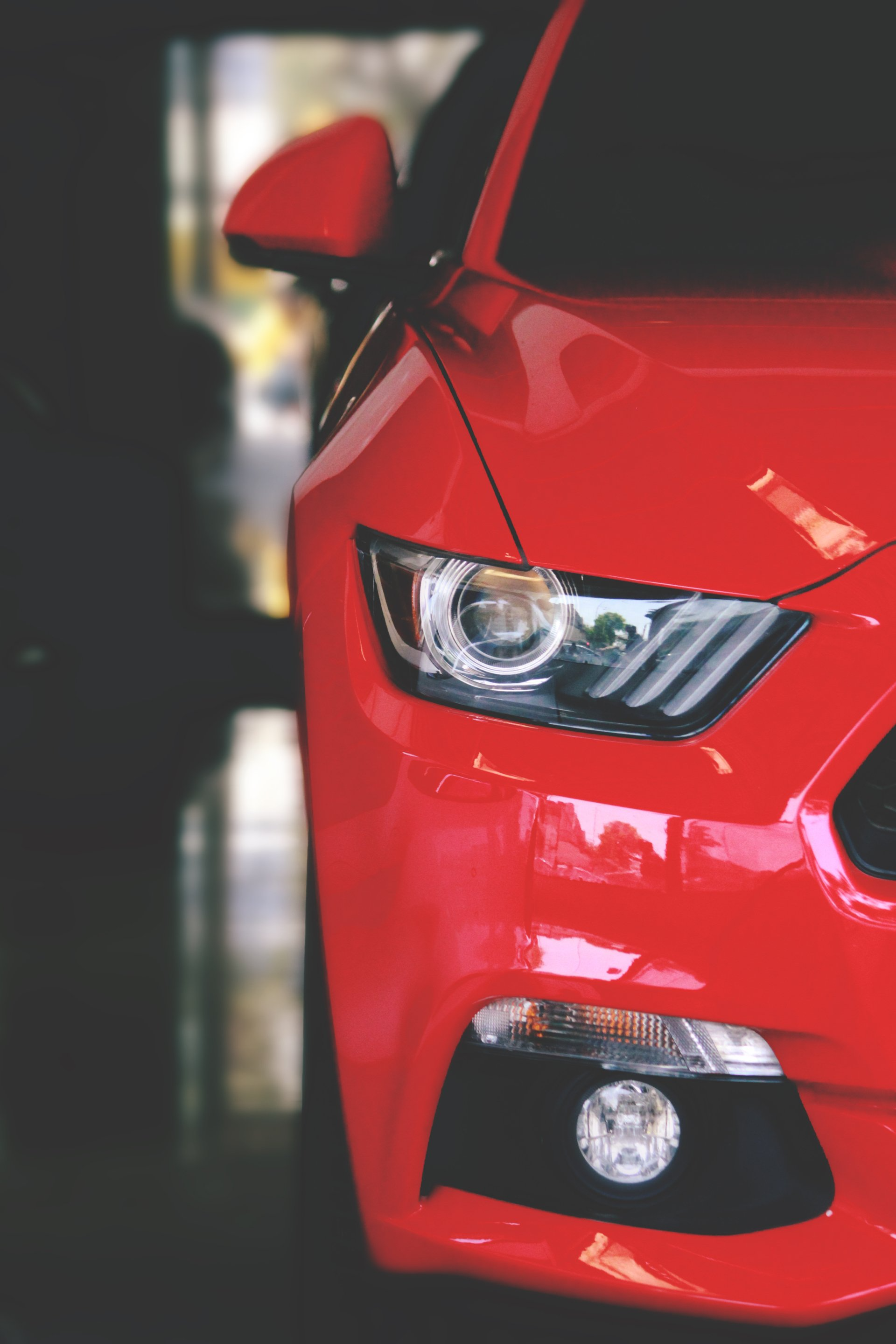 A close up of the front of a red car