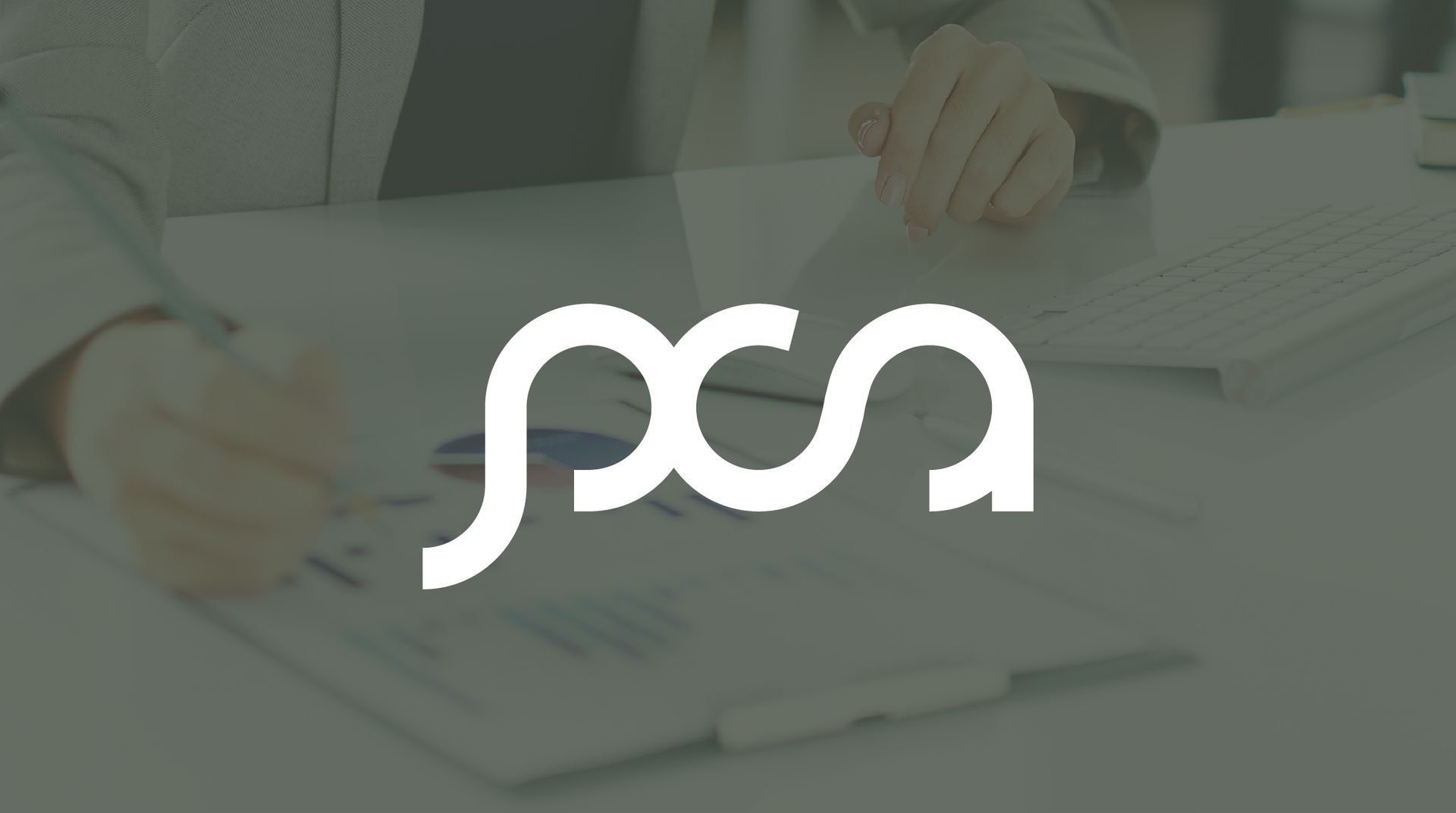 White logo "PCA" on a person working at a desk with documents.
