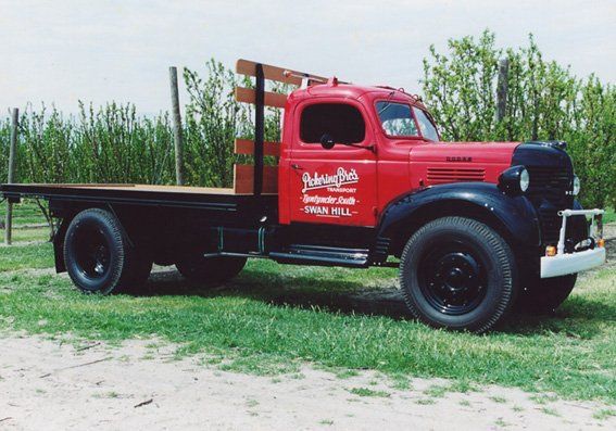 Red Truck and Grass Outdoor | Swan Hill, Vic | Pickering Transport Group
