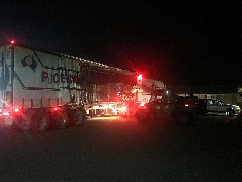 A Truck and a Forklift Unloads Pallets of Water | Swan Hill, Vic | Pickering Transport Group